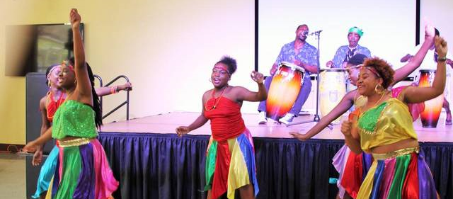 Members of the NSL Dance Ensemble entertain the audience during the Fourth Annual Haitian-Caribbean Book Fair, held at the Caribbean Marketplace at the Little Haiti Cultural Complex over the weekend. Caitlin Granfield