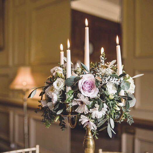 Flowers and candles - the perfect combination. Candelabras add the decoration without cluttering the surfaces, leaving more room for the wine bottles!