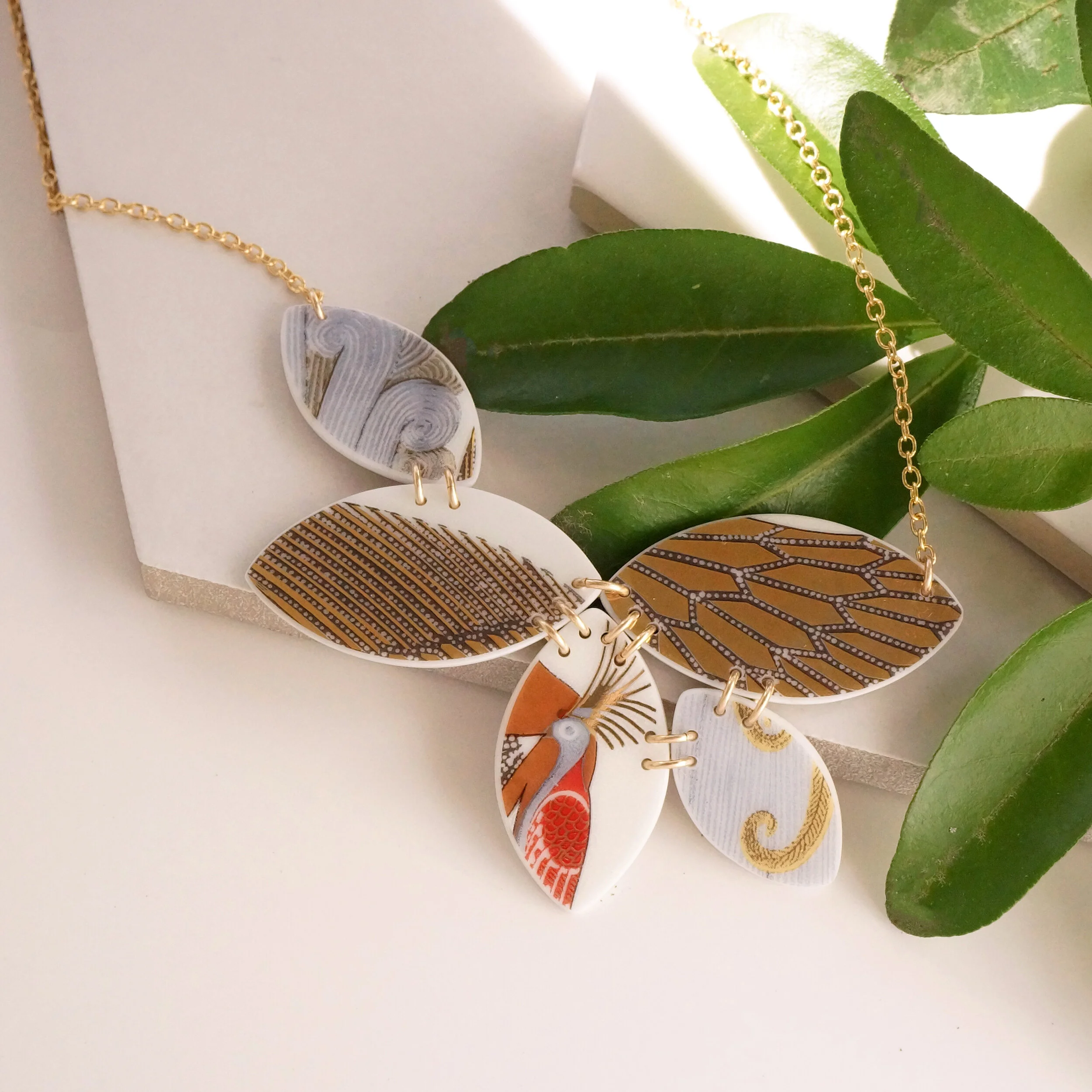 gold necklace made from broken china