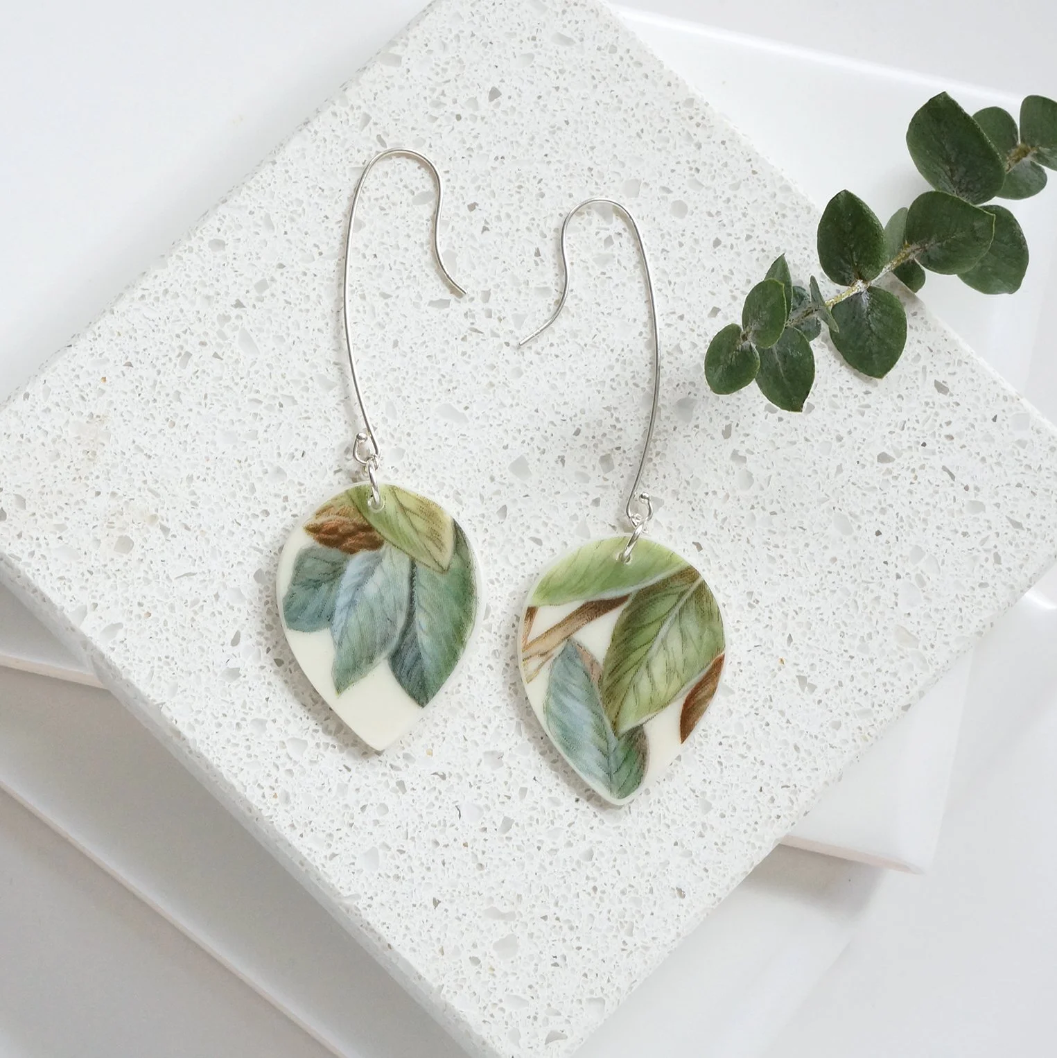drop shaped Earrings made from vintage boehm illustration china with green leaves and sterling silver extra long ear wires by material and movement