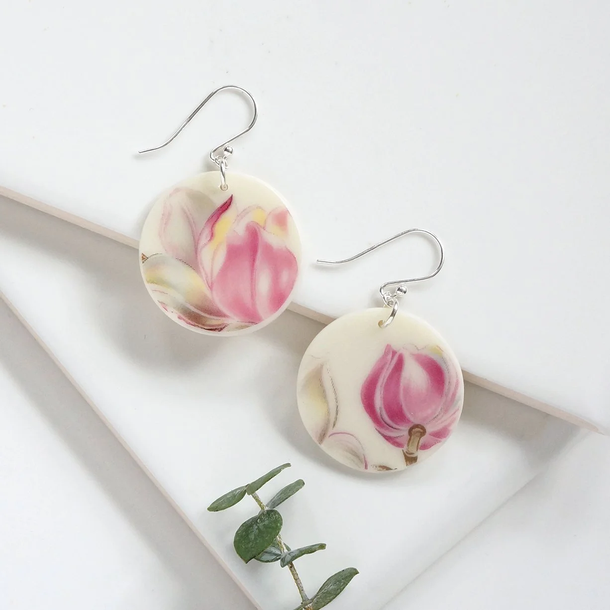Round orb shaped Earrings made from vintage Boehm illustration china with pastel pink and grey tulips and sterling silver ear wires by material and movement