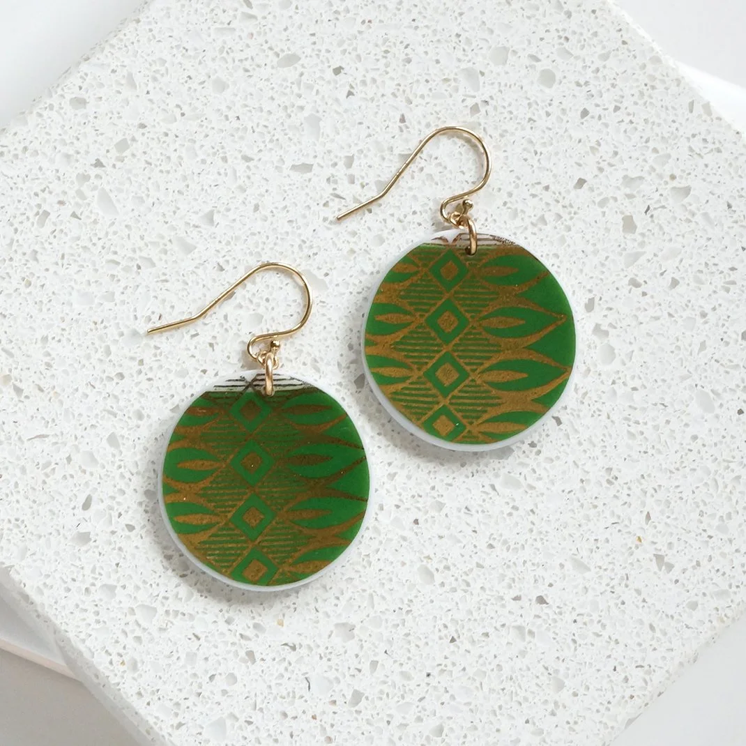 Round orb shaped Earrings made from vintage Bavarian china with green and shiny gold and gold fill ear wires by material and movement