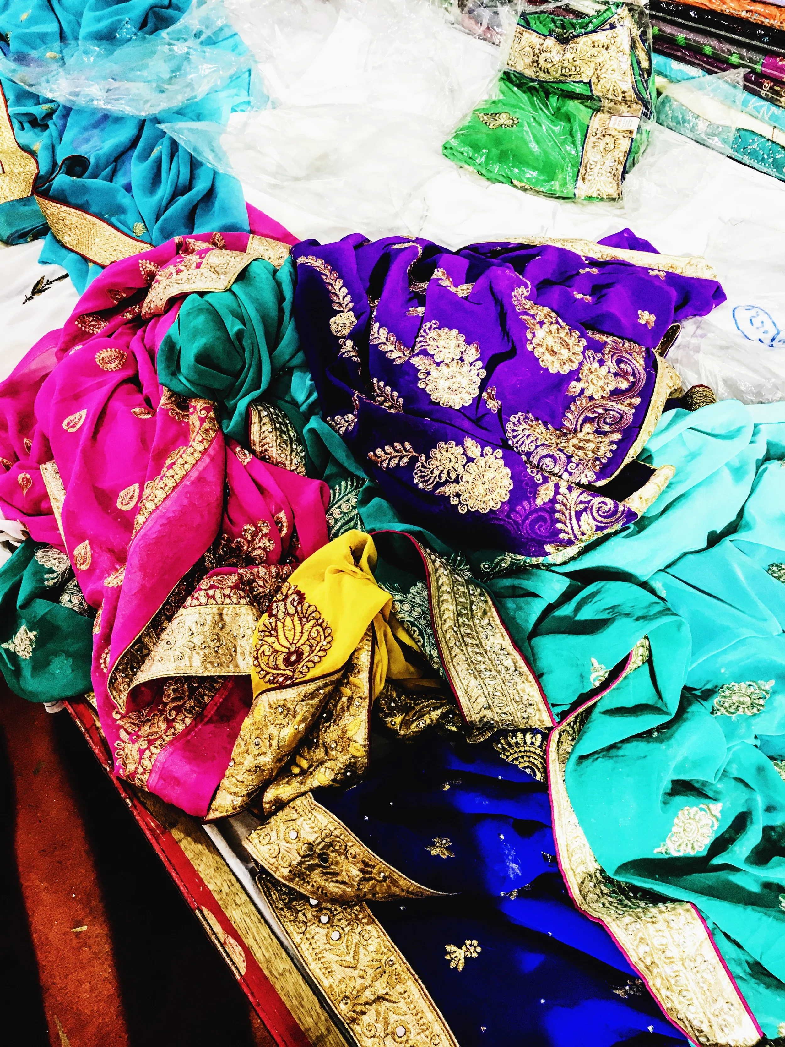 a colorful pile of saris we played dress up in (hehe oops)