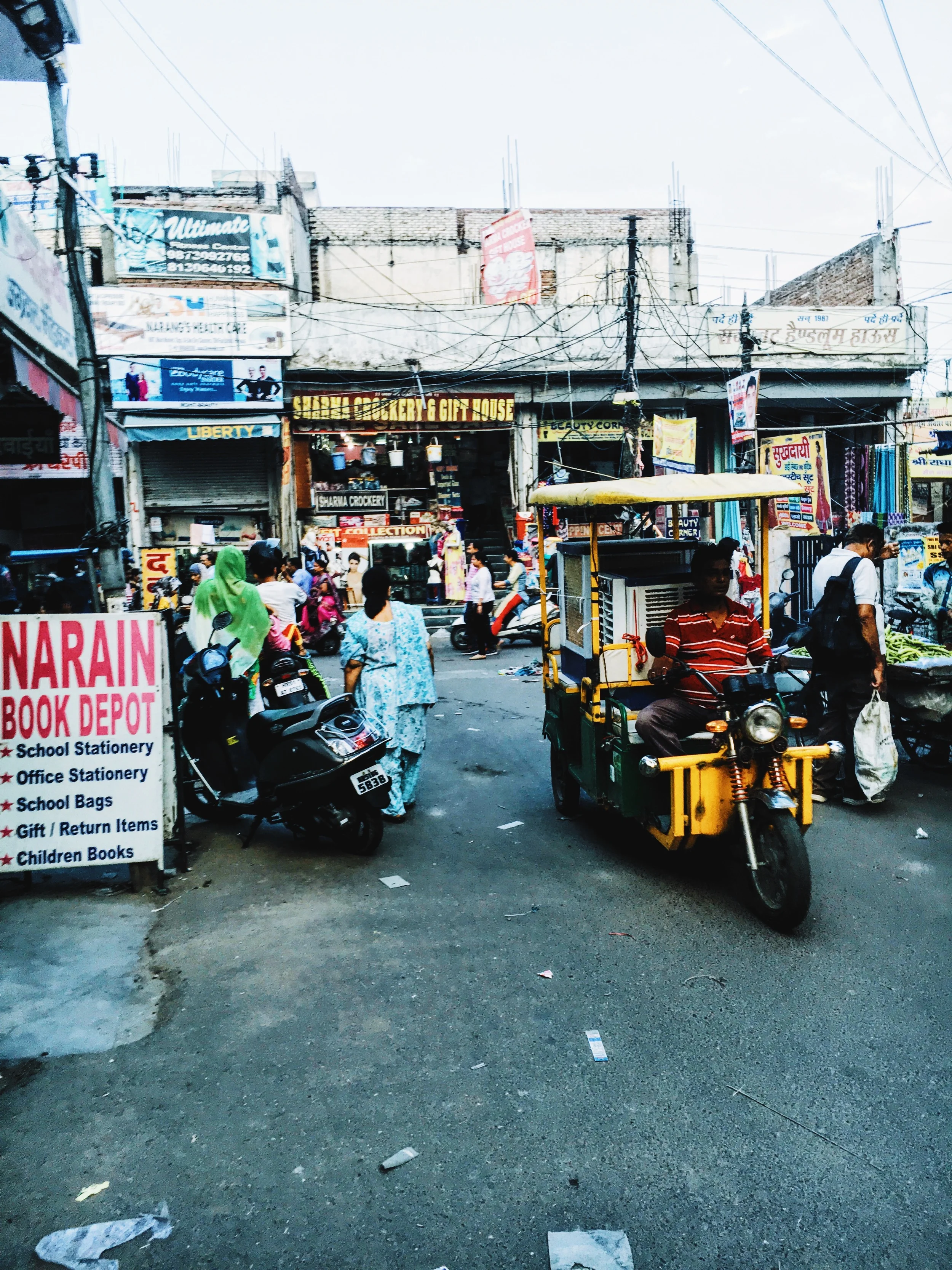 rare picture of a single tuktuk on the streets...this dude is using his to transport something apparently... 