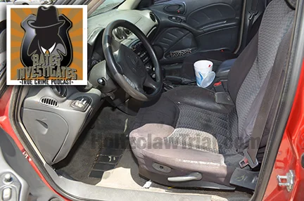 Interior of Jannie Ligons’ car with cup of ''Kool Aid.’