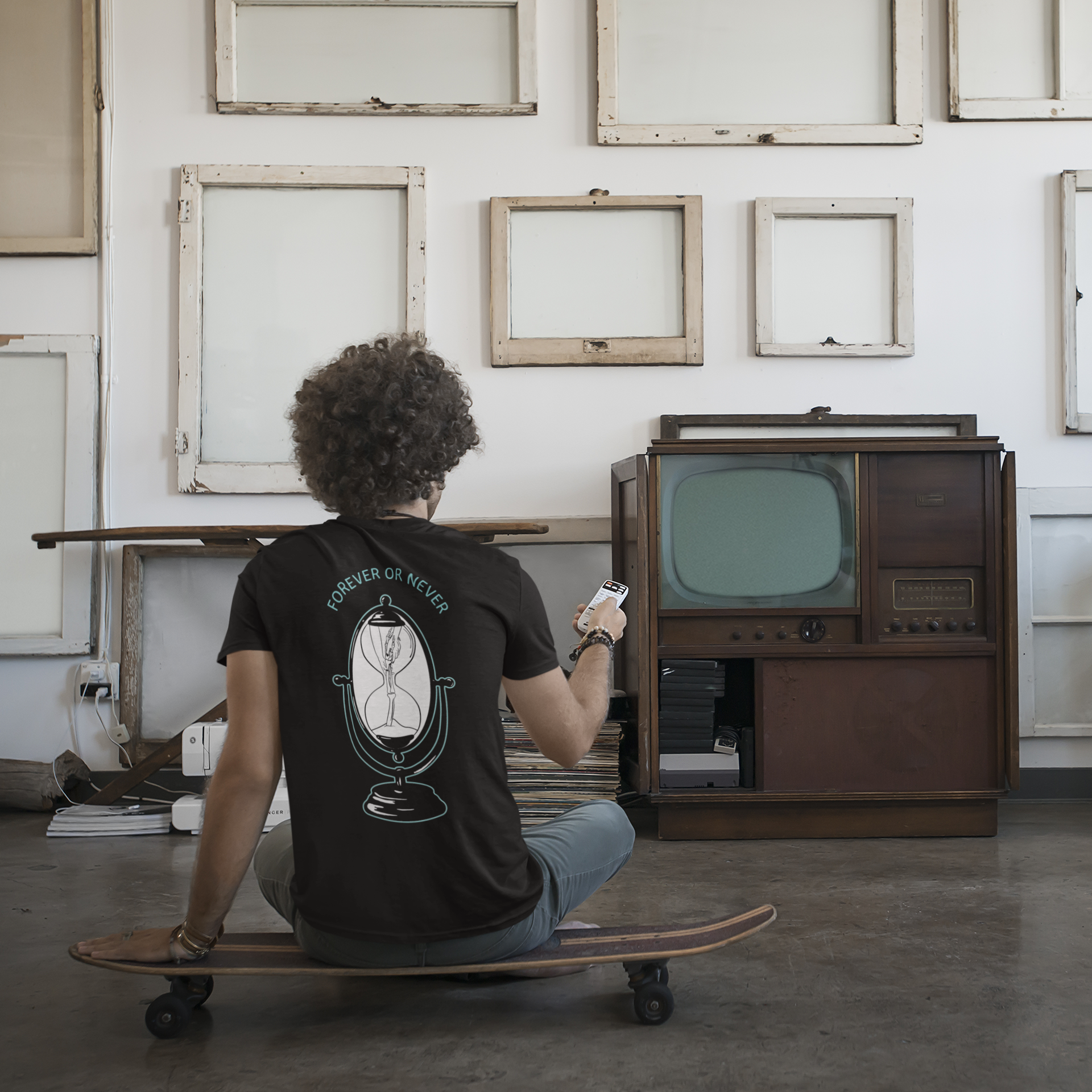 back-view-mockup-featuring-a-curly-haired-man-watching-an-old-tv-43248-r-el2.png