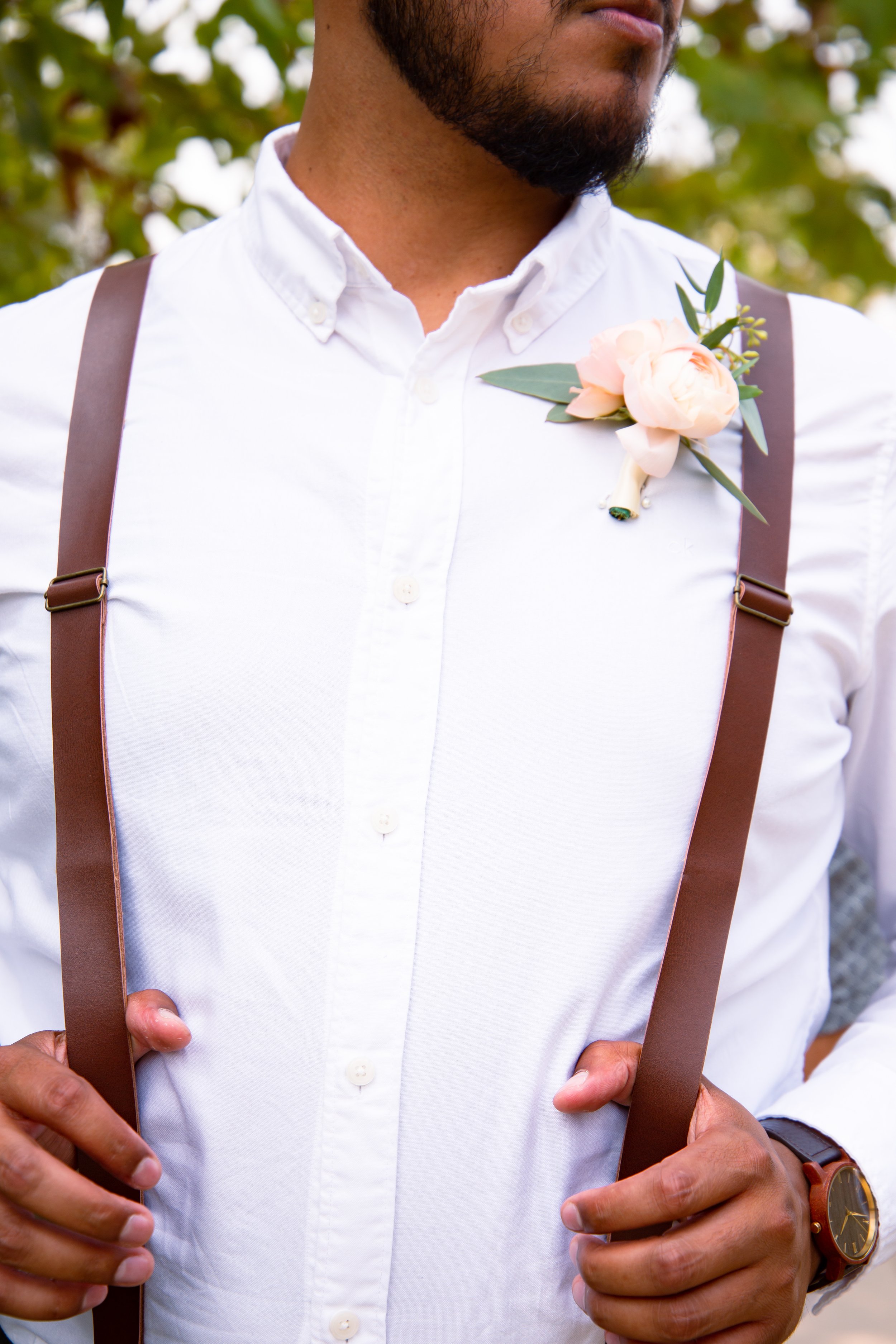 groom-wedding-details-suspenders-outdoor-portrait