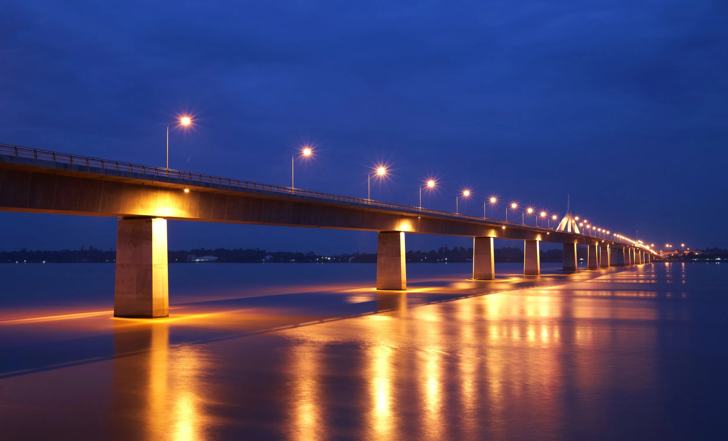 vecteezy_concrete-bridge-and-river-in-twilight_3405921.jpg