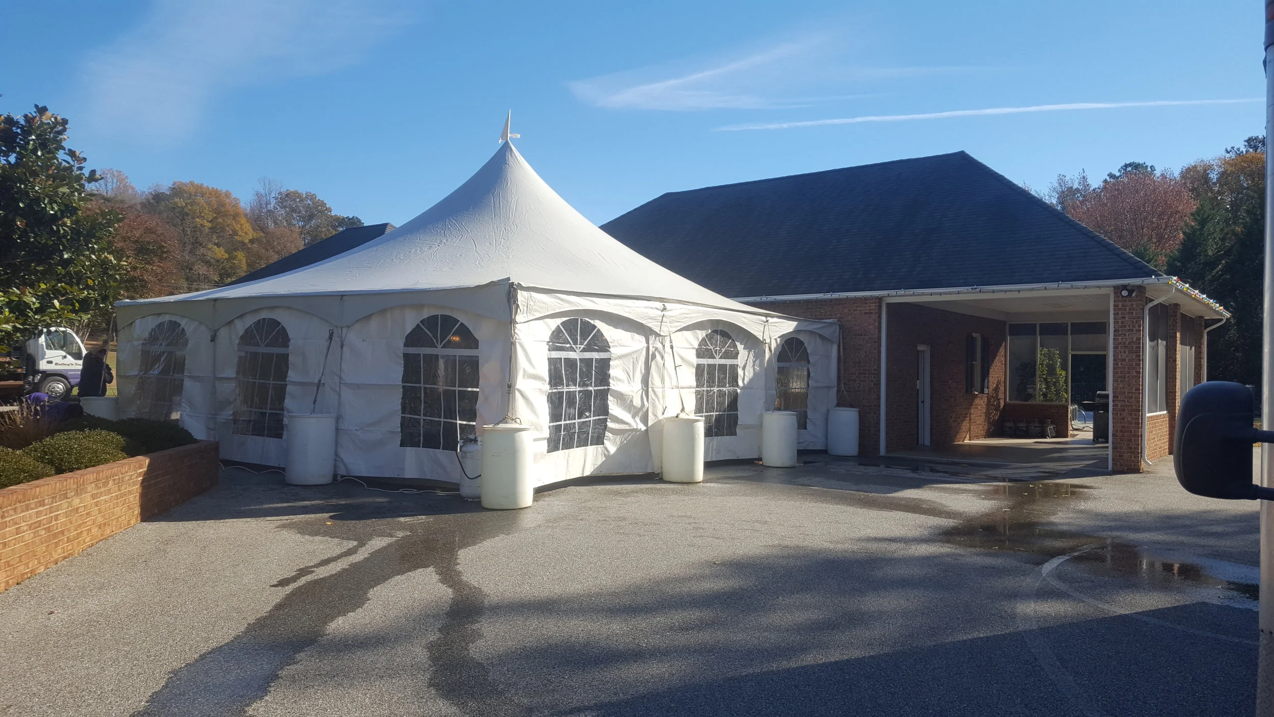 Water barrels anchor 30x30 tent on hard surface