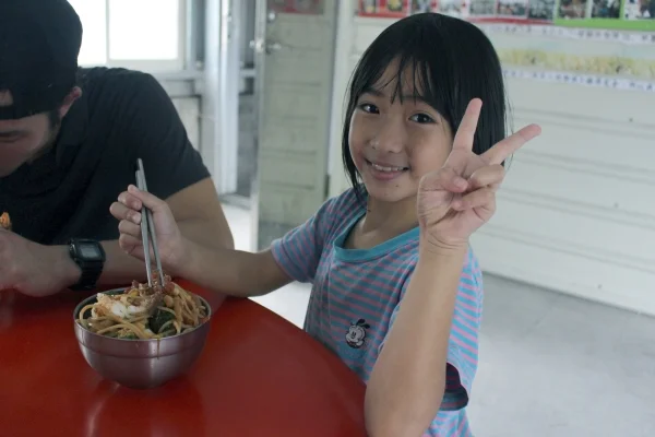 Giving the peace sign is Bao-Ting, enjoying her dinner served by her village’s Community Kitchen: the program we’re working to improve in Taiwan 12/8/16