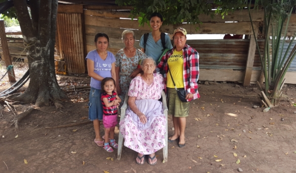 The little girl is Sara, who suffers from severe stunting (she’s 3 1/2 years old but only as tall as an average 2 year old; she just recently learned to walk, and has yet to learn to talk), Sara’s mom is behind her, Grandma is standing to Ruth’s right, and Great-grandma is seated, in front.