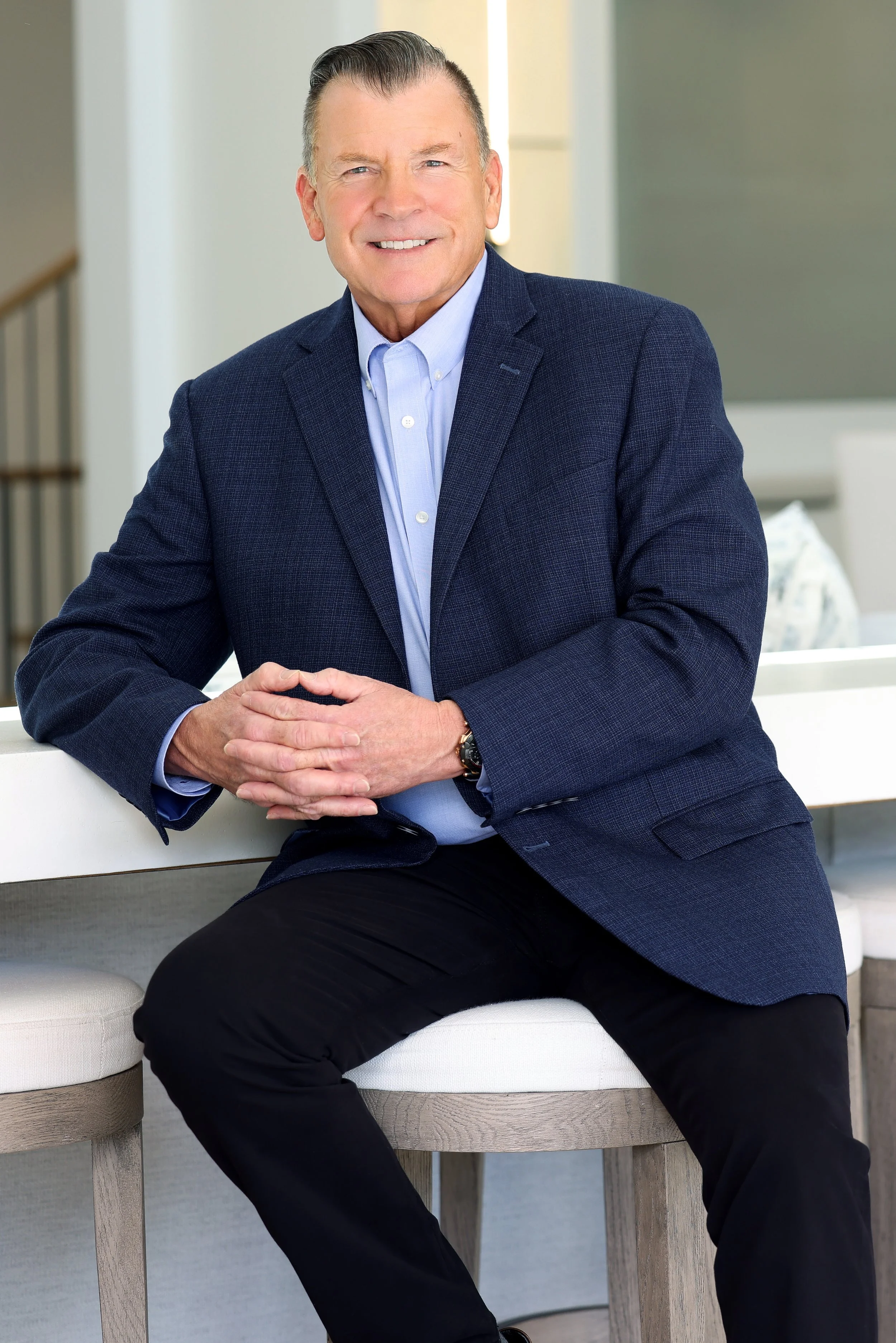 Lifestyle photo of a luxury realtor by Kenneth Dolin, LA's top executive photo studio, creating one-of-a-kind luxury real estate photography and video for clients in Los Angeles, Beverly Hills and more. Branding-photography for top producing Luxury r