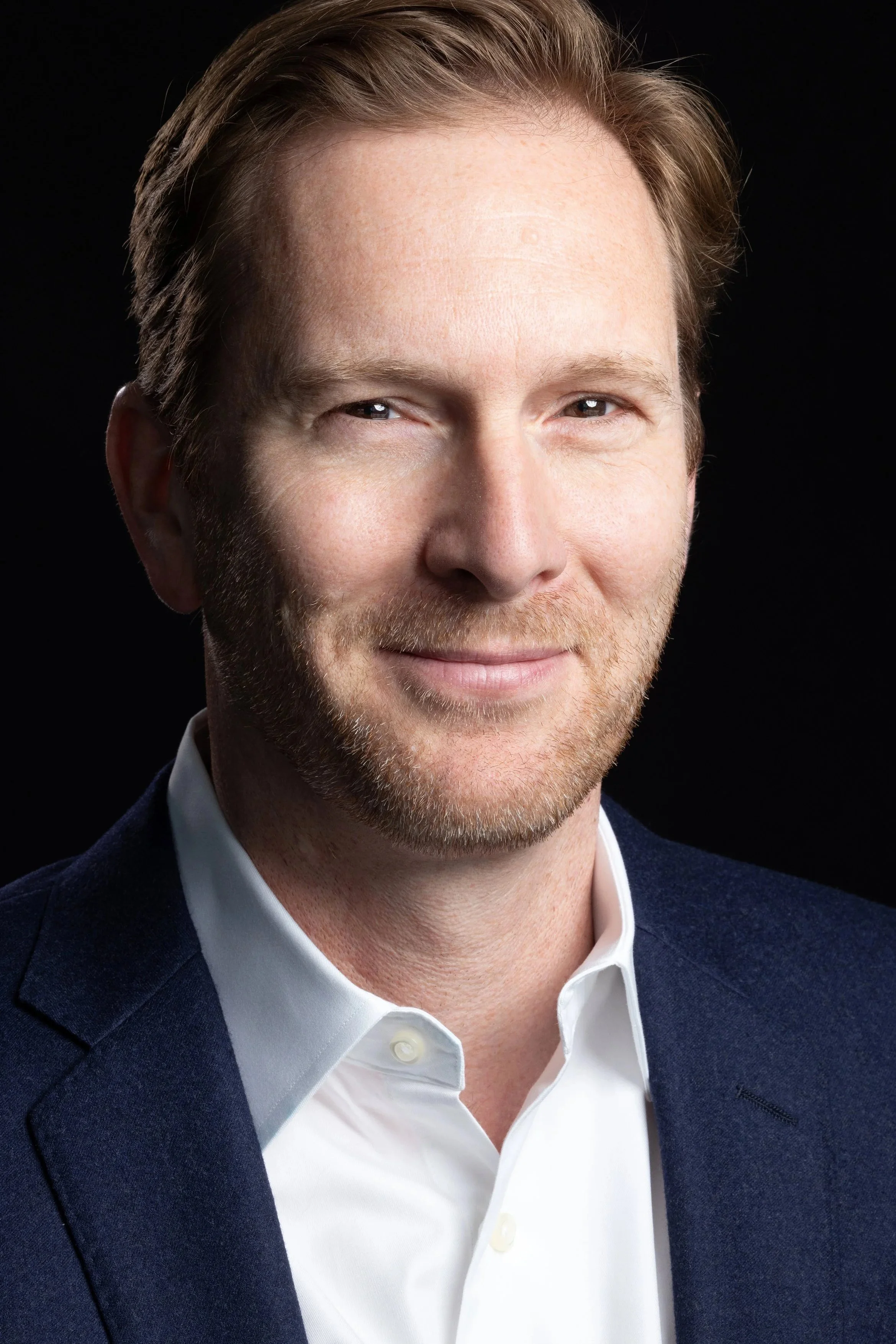 Dramatic business headshot by top Los Angeles corporate photographer Kenneth Dolin, specializing in brand-building headshots for professionals, realtor headshots, corporate headshots, team headshots and branding for executives in Los Angeles 90210, 9