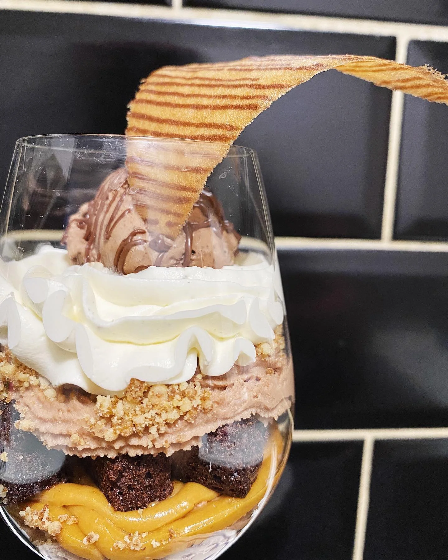 Chocolate parfait // Layers of almond crumble, ganache mont&eacute;e, caramel cr&eacute;meux, gateau chocolat, vanilla chantilly, topped with chocolate ice cream, drizzled in sauce au chocolat, and tuile. #mrAdamJeffery
.
.
.
.
.
.
.
#pastry #pastryc