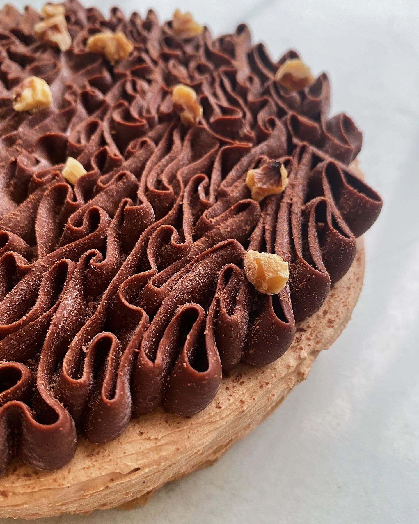 Chocolate Mille Cr&ecirc;pes // Layers of wafer thin cr&ecirc;pes and rich chocolate cr&egrave;me l&eacute;g&egrave;re. Topped with swirls of decadent chocolate ganache. Who needs hot cocoa this Christmas when you&rsquo;ve got a creamy cake 🤷🏾&zwj;