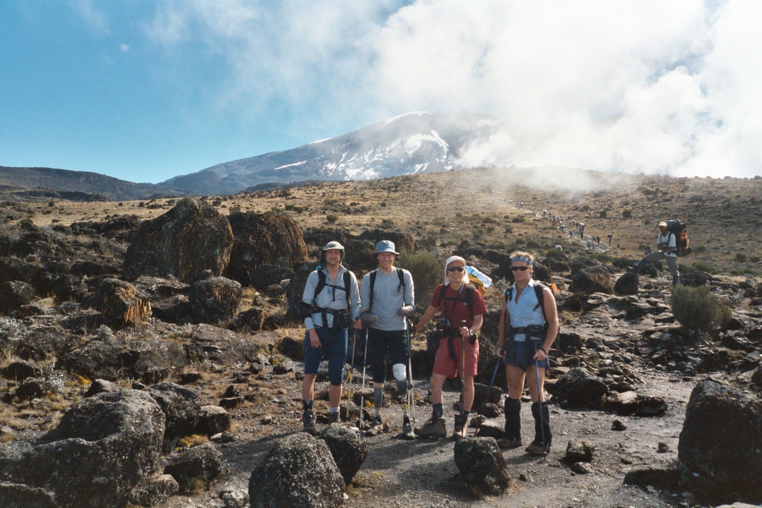 Paul Pritchard (left) with his three other disabled climbing mates with Mount Kilimanjaro behind.