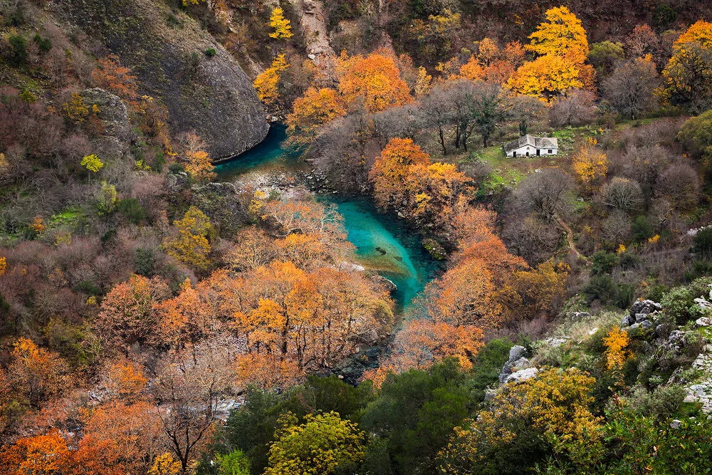 Vikos This traditional Zagori village is built on the edge of the Vikos gorge (altitude 770 m) where the national part of Vikos-Aoos begins. After 30 minutes of hiking along the trail, you arrive at the springs of the Voidomatis river, an ideal place for excursions and mountain sports. It is located 53 km NW of Ioannina.