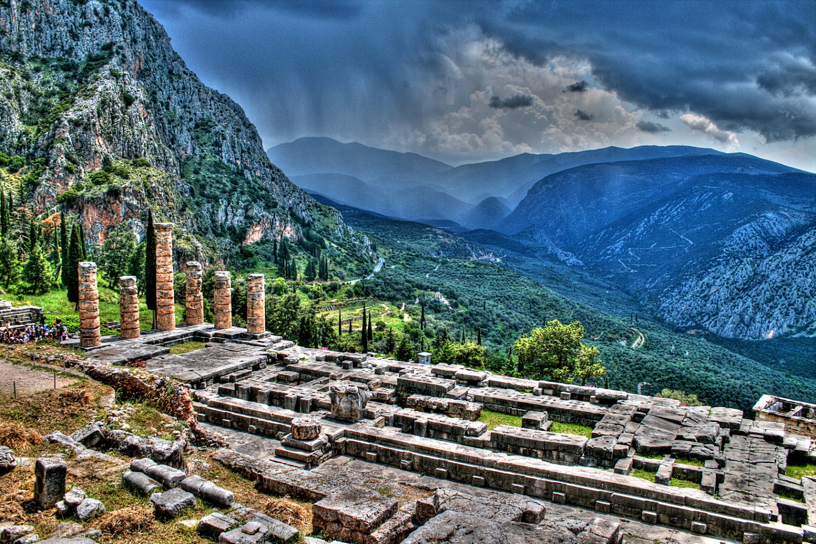 ancient-ruins-of-delphi-and-the-sun-peaking-through-the-clouds.jpg