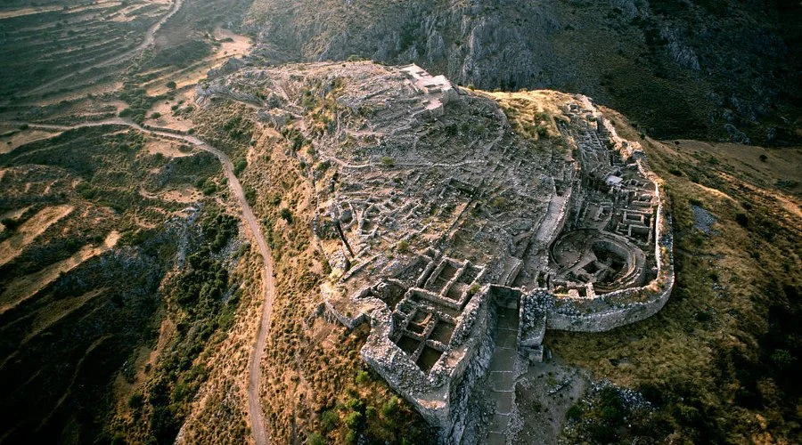 This is an aerial view of the Mycenaean ruins in Greece. Once ruled by King Agamemnon, who fought in the Trojan War, the site is now a popular tourist destination.