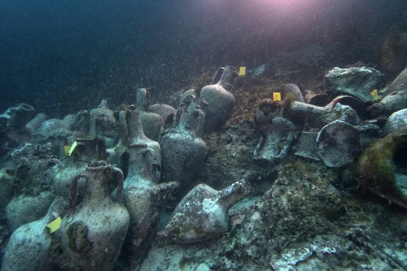 In this photo taken on Sunday, April 7, 2019, ancient amphoras lie at the bottom of the sea from a 5th Century B.C. shipwreck in Greece, near the coast of Peristera, Greece. (AP Photo/Elena Becatoros)
