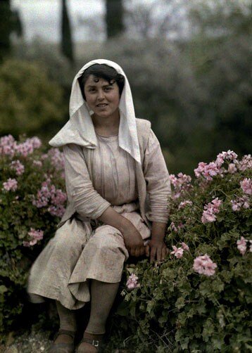   A young woman in a flower garden, Corfu.  
