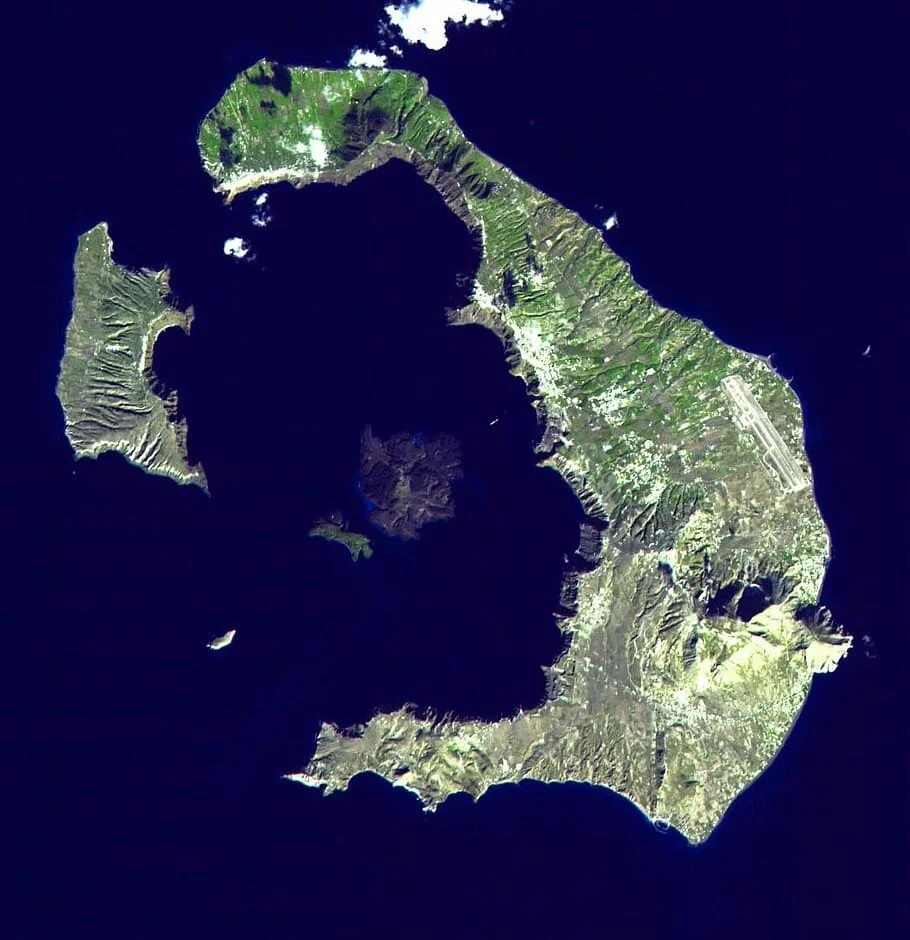 The island of Santorini (ancient name: Stronghili). The volcano which blew up 3,000 years ago was in the center of the caldera, with the explosion leaving only the outsides of the mountain extant, as we see today. Credit: px fuel/Satellite image