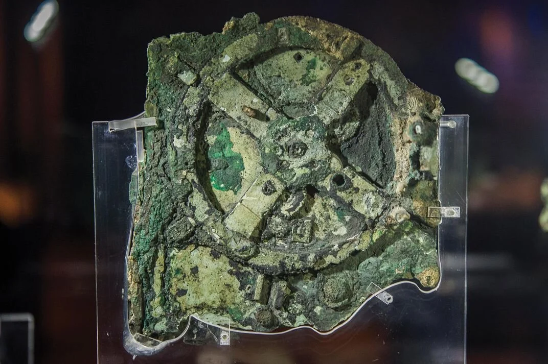 The Antikythera mechanism is an ancient Greek hand-powered orrery, described as the first analogue computer, the oldest known example of such a device used to predict astronomical positions and eclipses for calendar and astrological purposes decades in advance.