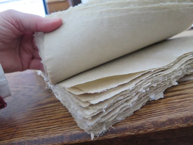 using a bone folder you carve on paper you make is good work