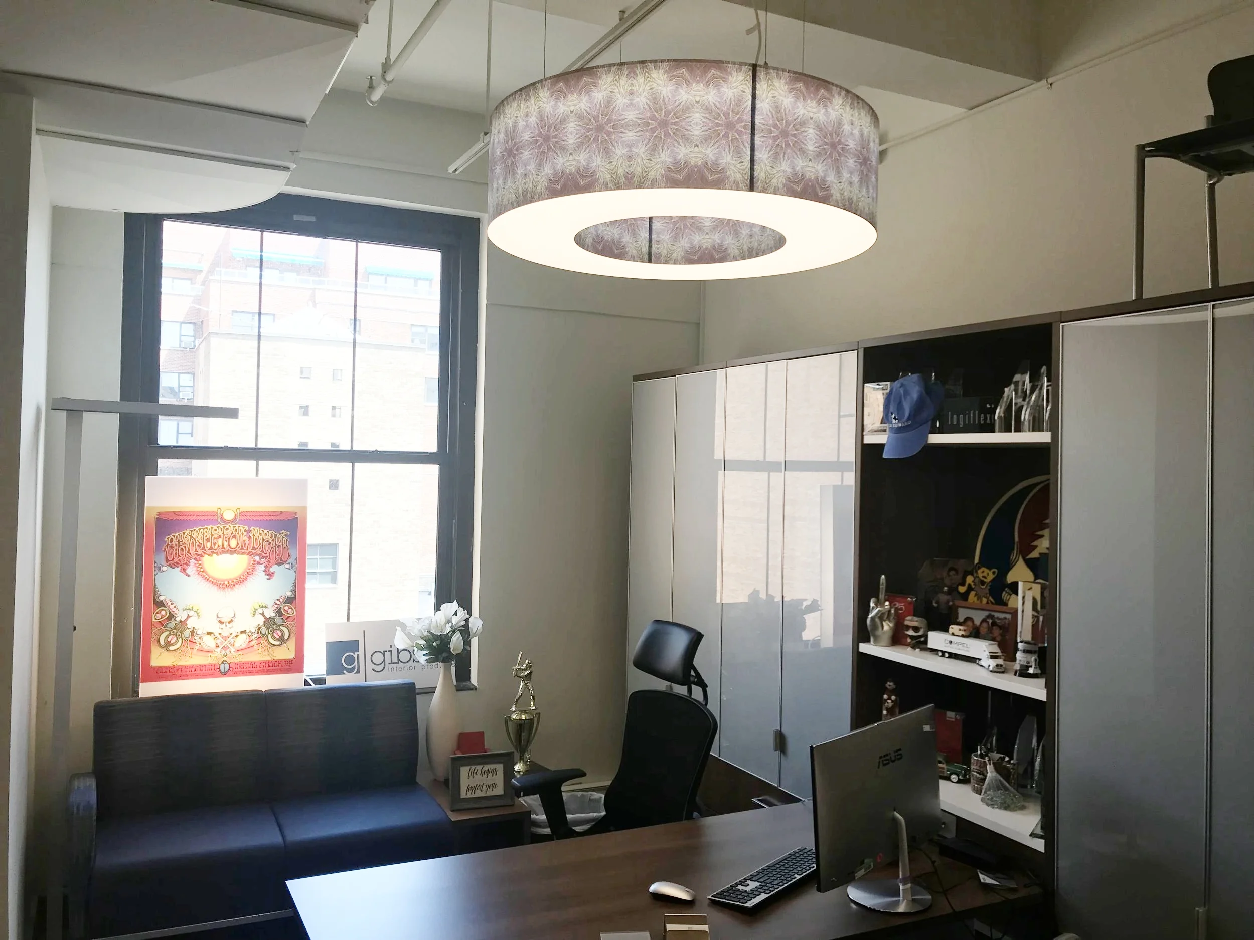 In the private office at Gibson, you will find the Donut. This fixture has found it's home in hospitals, schools, offices, and more settings because of its simple shape and its unique colors and patterns. These fixtures are washable, making them perfect for places where high sanitary standards are required.