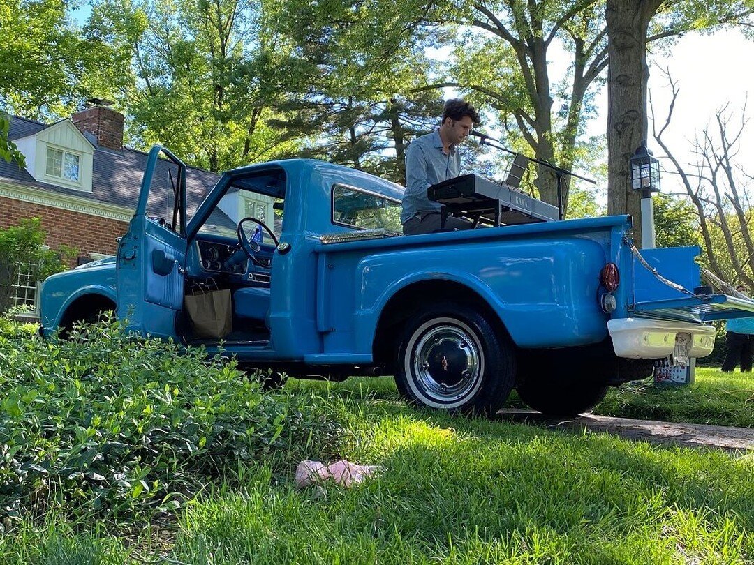  Bass-baritone Christian Pursell performs from the bed of is vintage blue pickup truck in College Hill. 