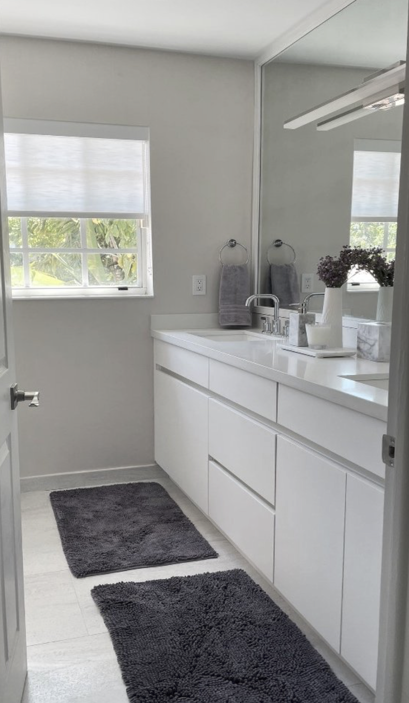 Coconut Grove bathroom remodel with modern vanity, clean lines, LED bar lighting, and custom double vanity