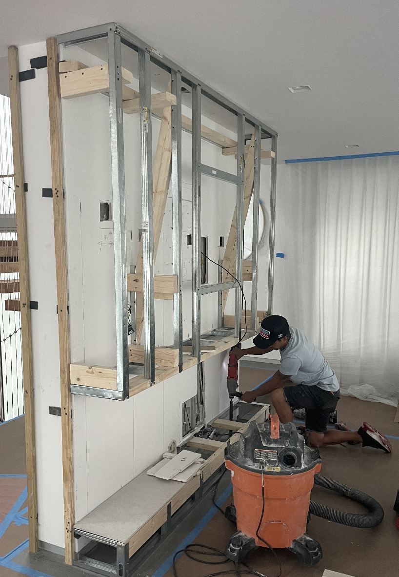 Custom media wall installation Hibiscus Island Miami Beach luxury interior renovation
