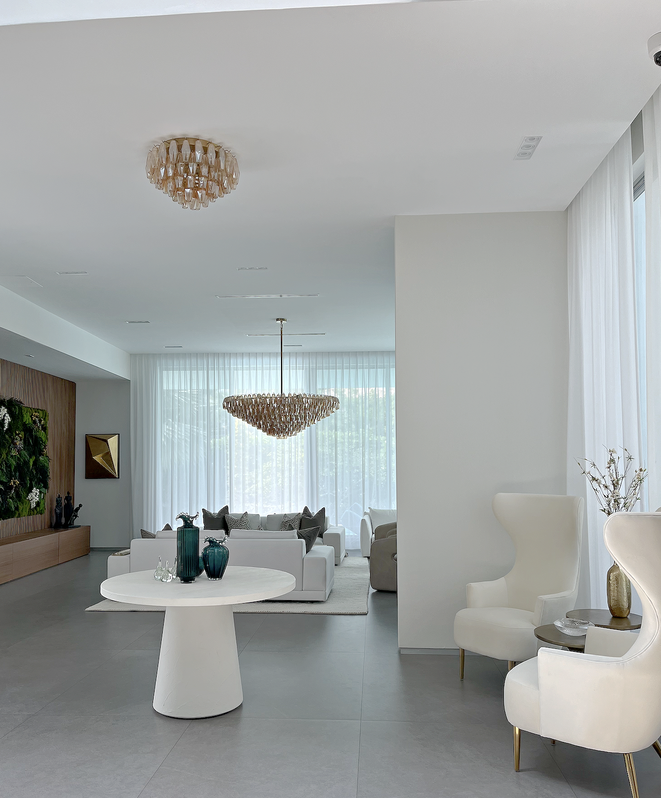 Structural remodeling created this sophisticated dk.teal living room with custom library and fireplace wall. 