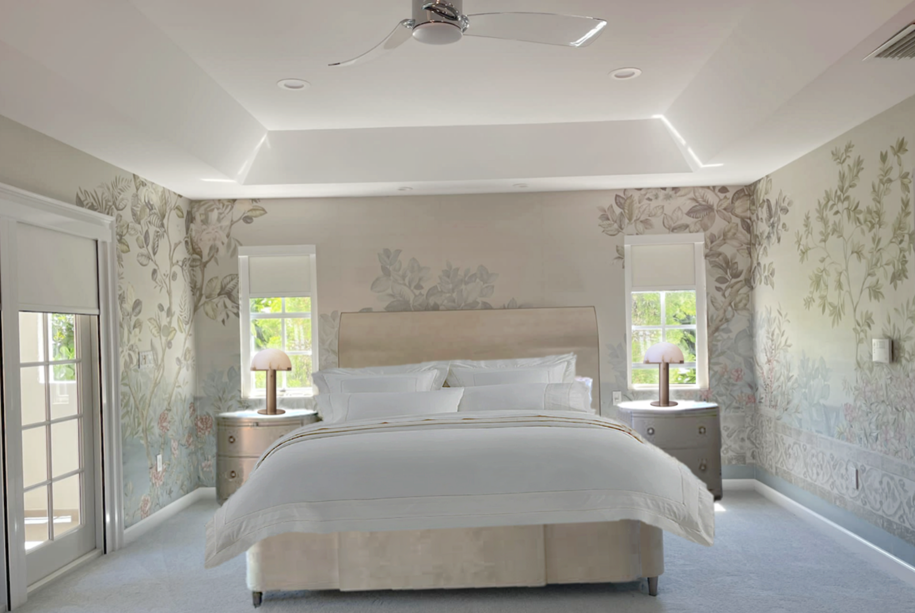 Completed luxury master bedroom suite remodel in Coral Gables showcasing a textured botanical wallcovering, a crisp custom ceiling drop with hidden LED lighting, and an elegant ceiling fan.