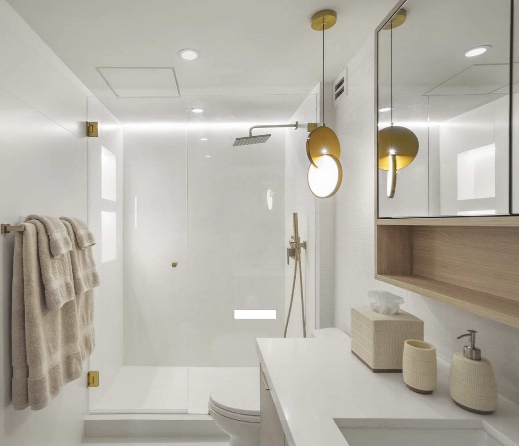 Modern Miami Beach condominium bathroom remodel with frameless glass shower, floating spa-like vanity and contemporary interior design