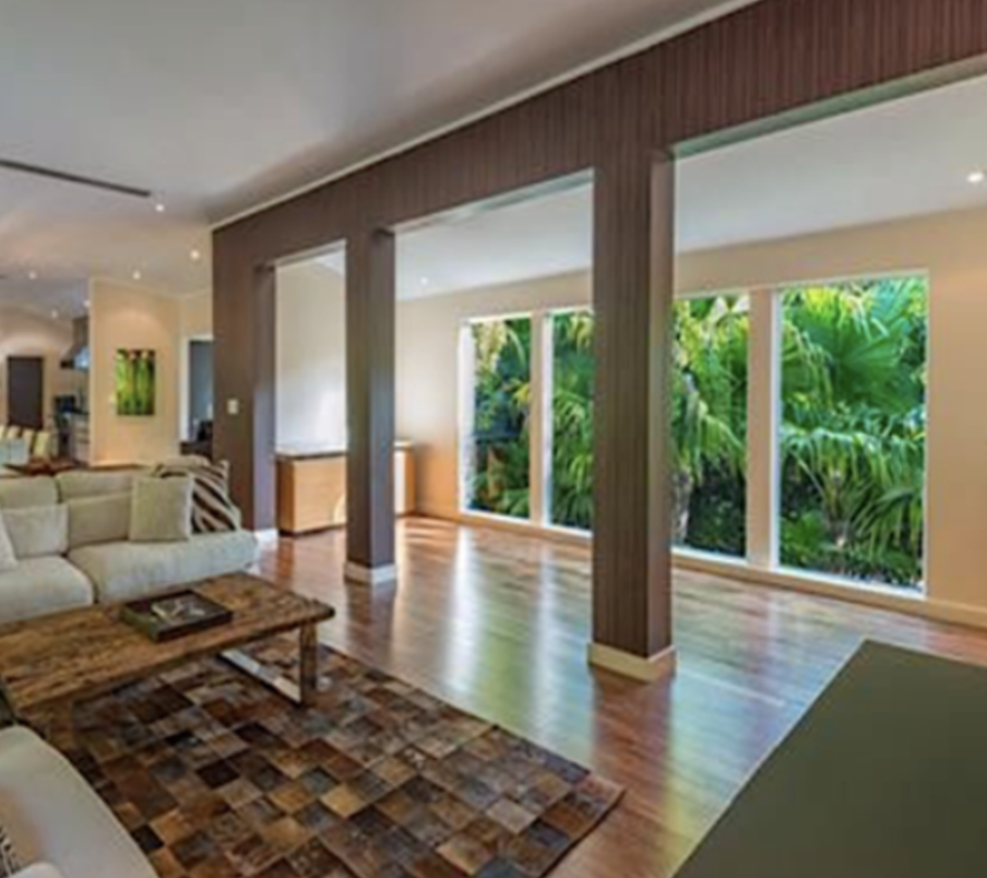 Structural columns were removed and replaced with a concealed steel beam system to create an open great room and dining space.