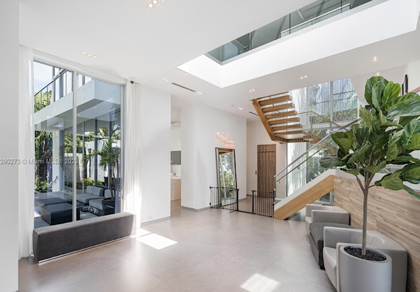miami-beach-hibiscus-island-luxury-home-foyer-before-renovation Double height foyer before renovation in prestigious Hibiscus Island Miami Beach luxury residence with floating staircase and floor to ceiling glass