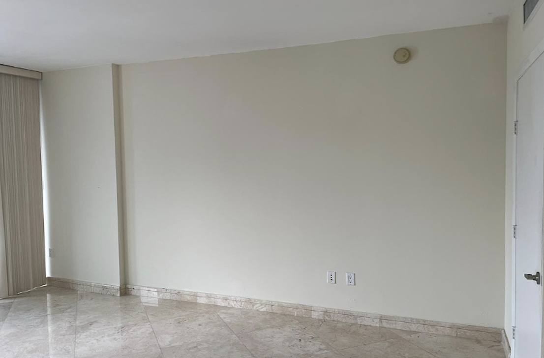 Empty Icon Brickell Miami condominium living room before Airbnb interior design renovation