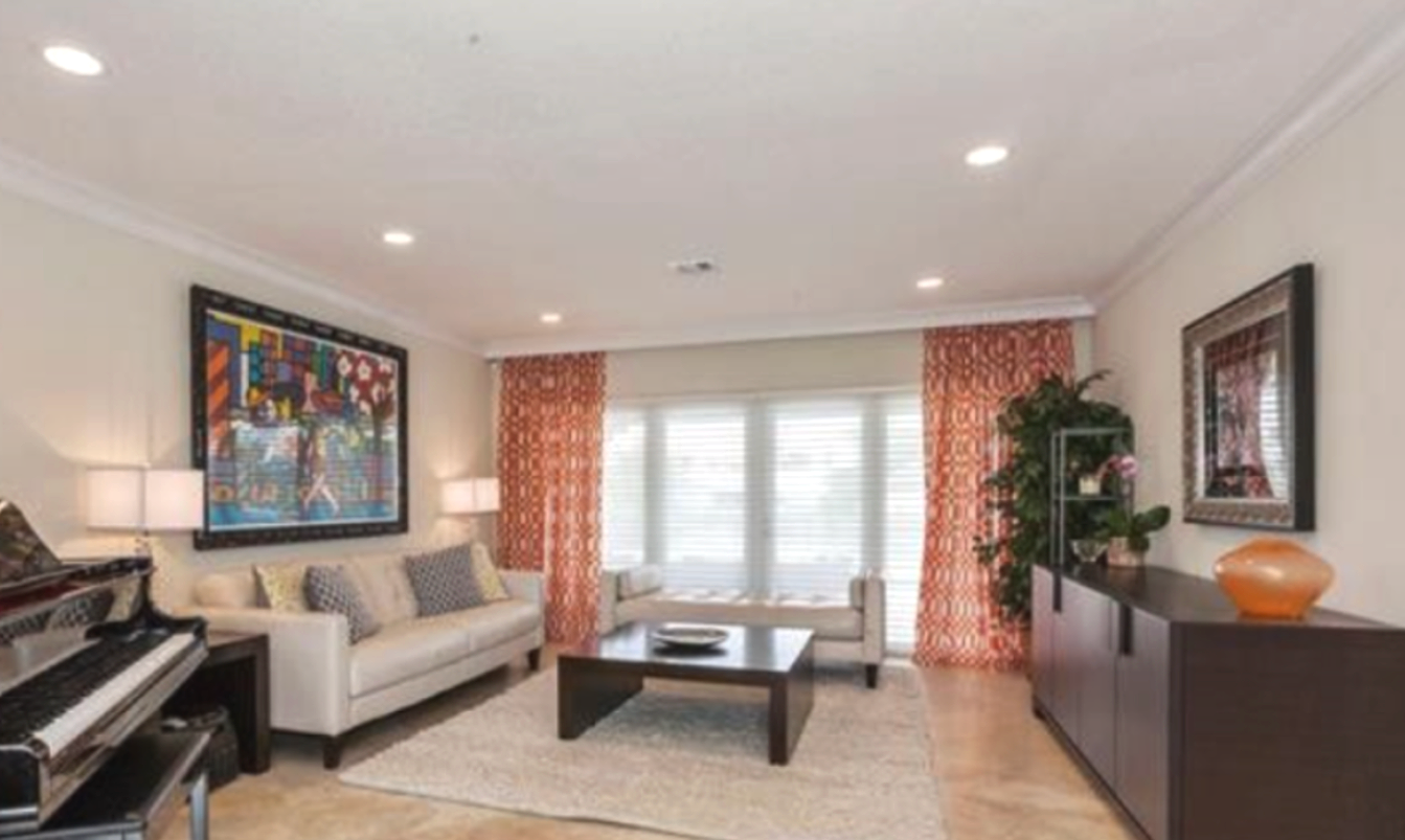 Outdated living room before remodel in North Miami ranch home
