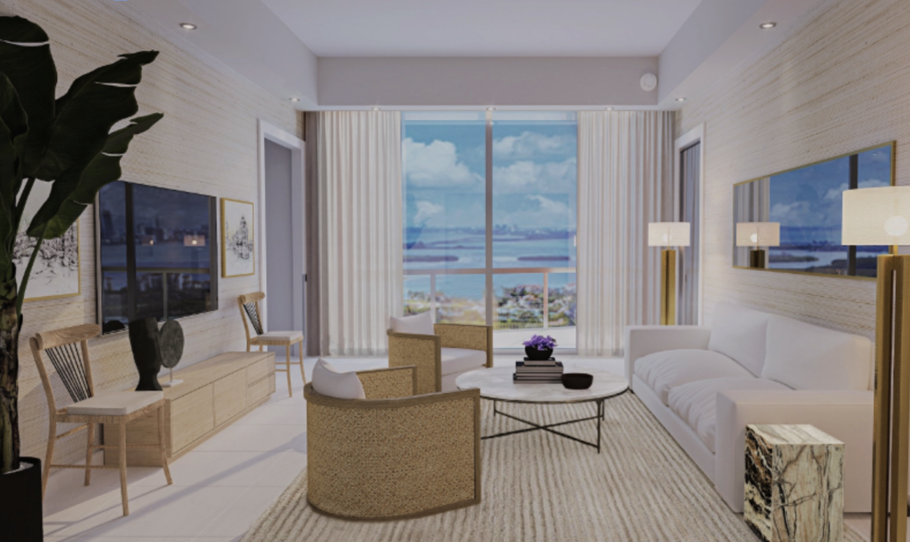 South of Fifth Miami Beach penthouse living room remodel with natural grass cloth wall covering, modern furnishings and a large mirror t