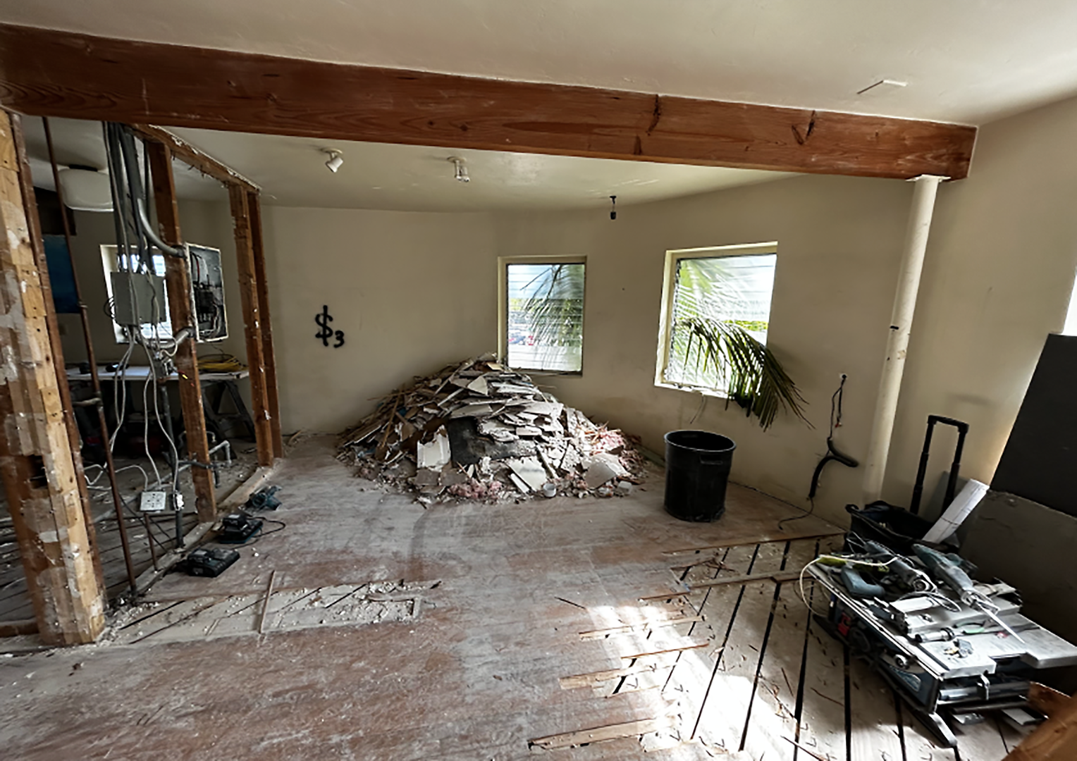 Miami Beach historical building before structural remodel showing exposed beam and kitchen wall.