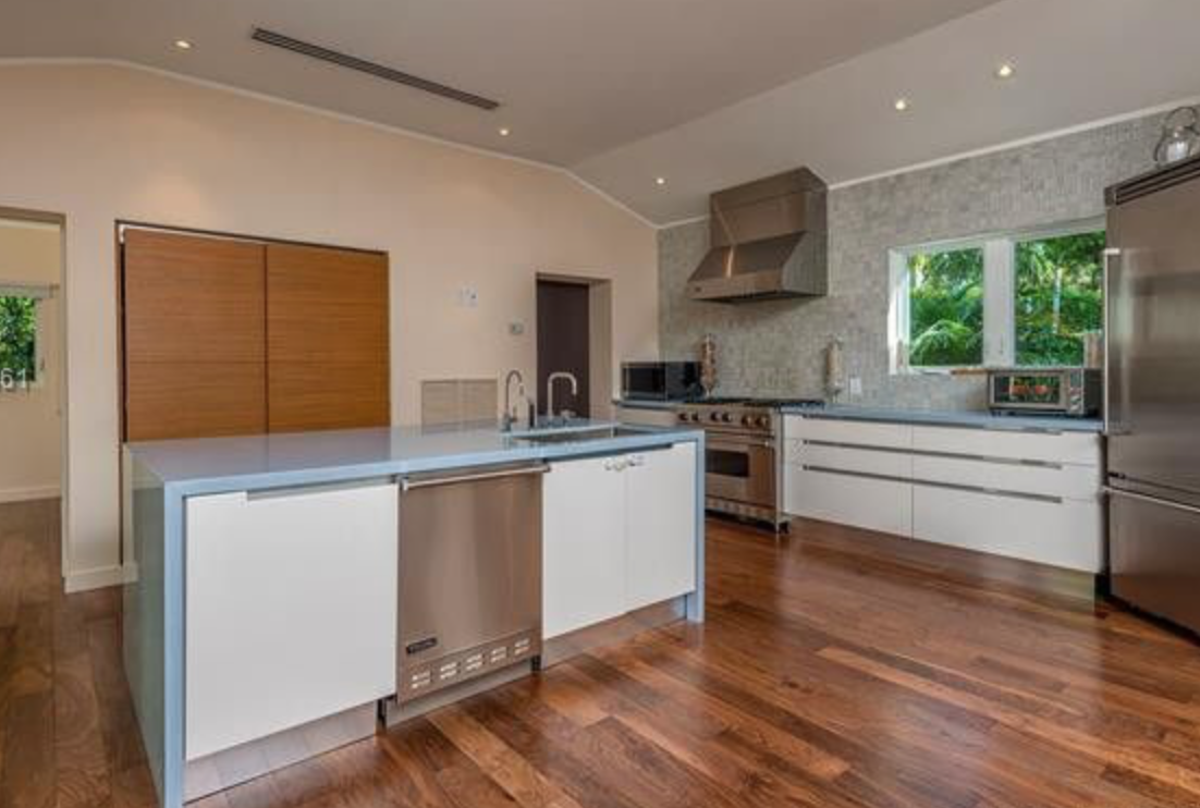 Before luxury kitchen remodel showing the original layout and finishes prior to custom cabinetry, lighting, and interior design