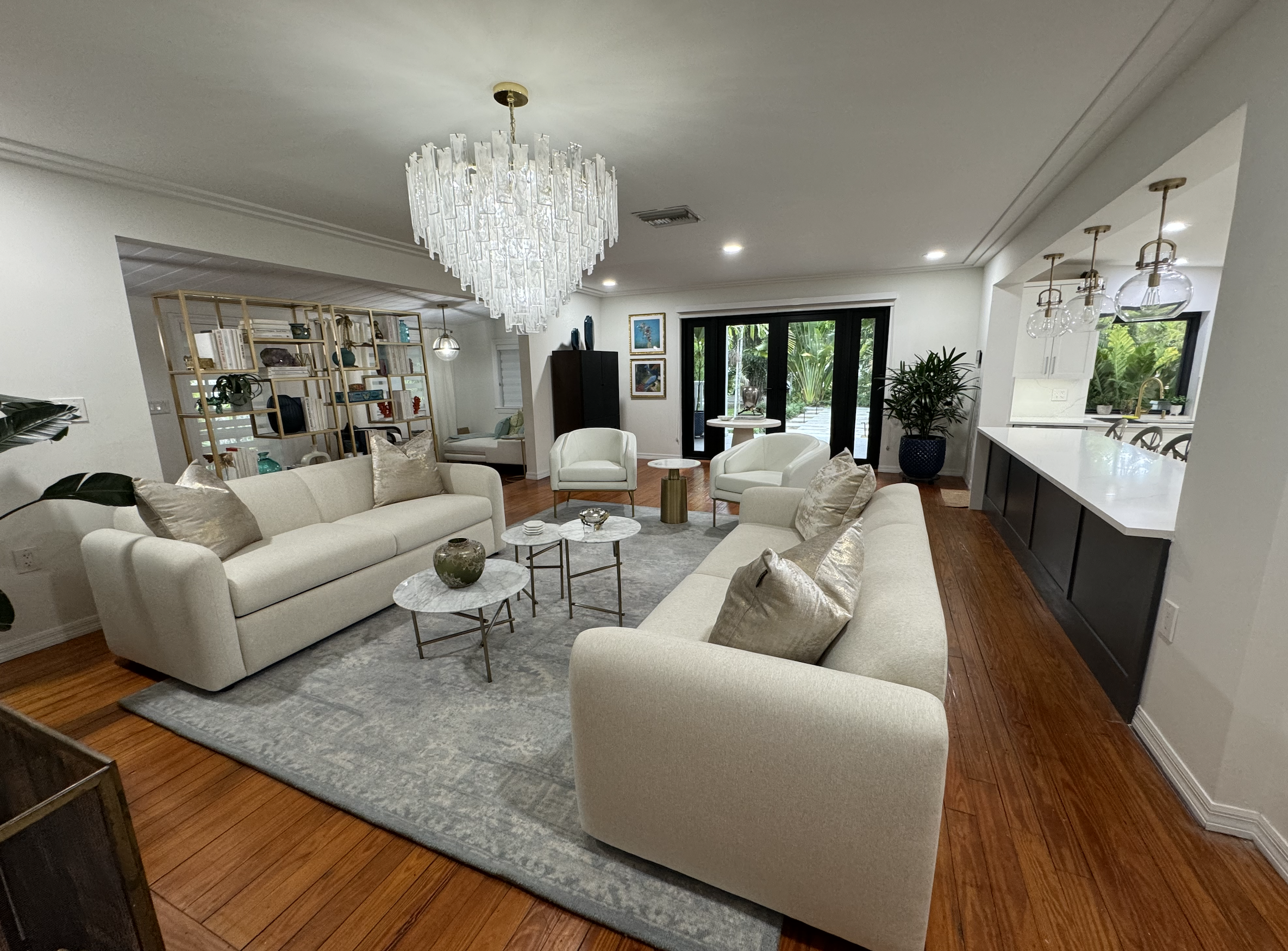 Luxury Coral Gables living room interior design after renovation with updated lighting, upscale furnishings, and refined layout