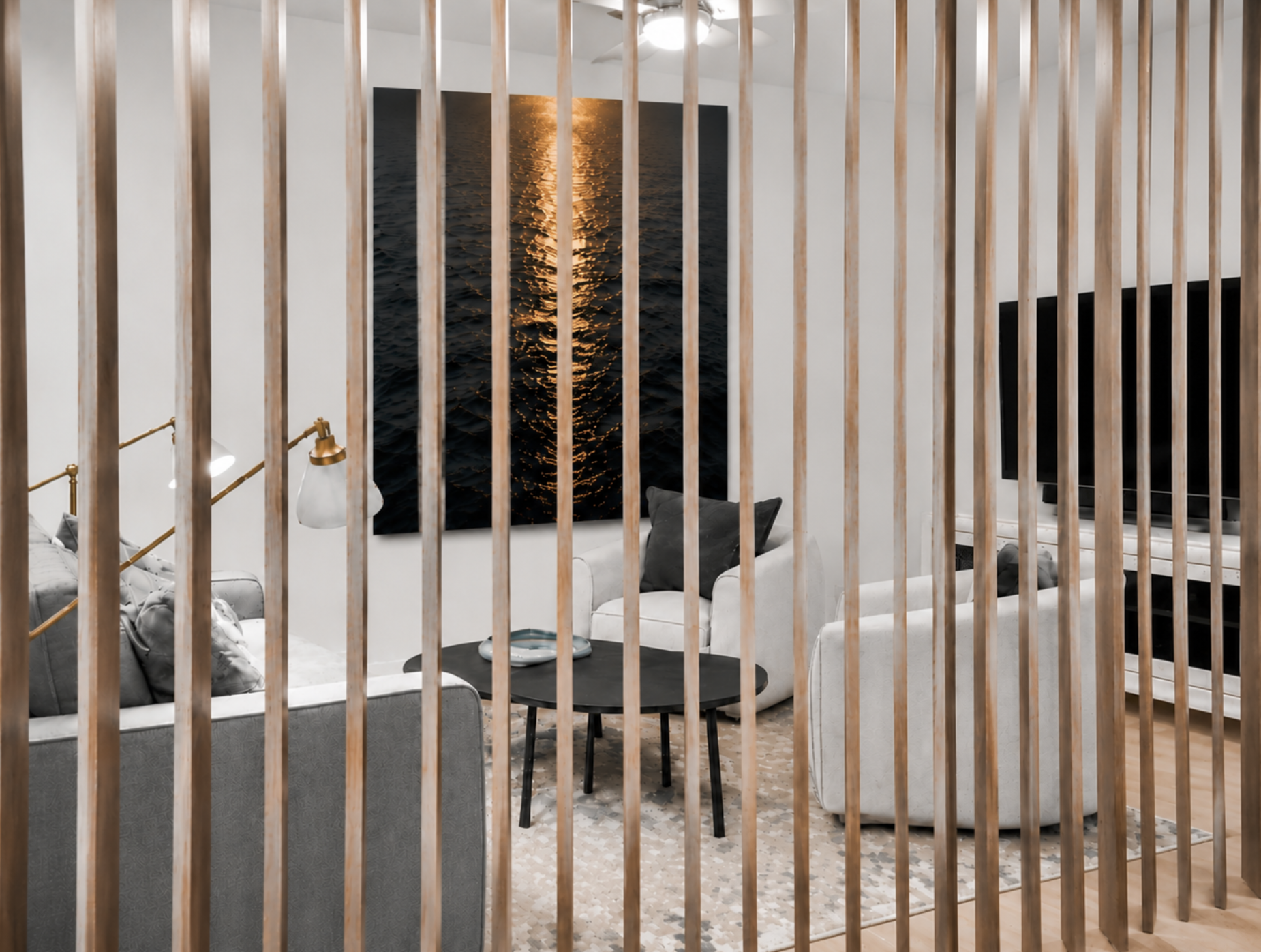 View of Den through newly constructed open slat wall showing lounge and ocean artwork
