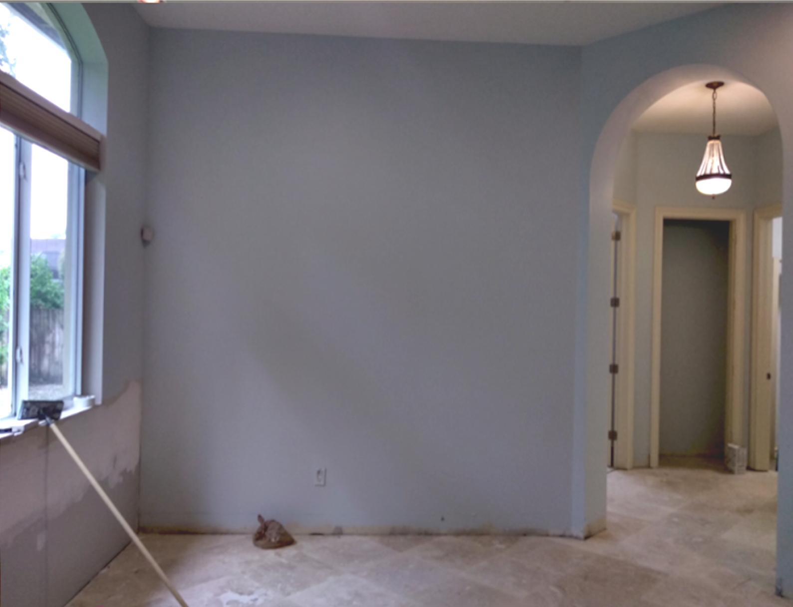 Coral Gables master suite before renovation with unfinished layout and arched doorway