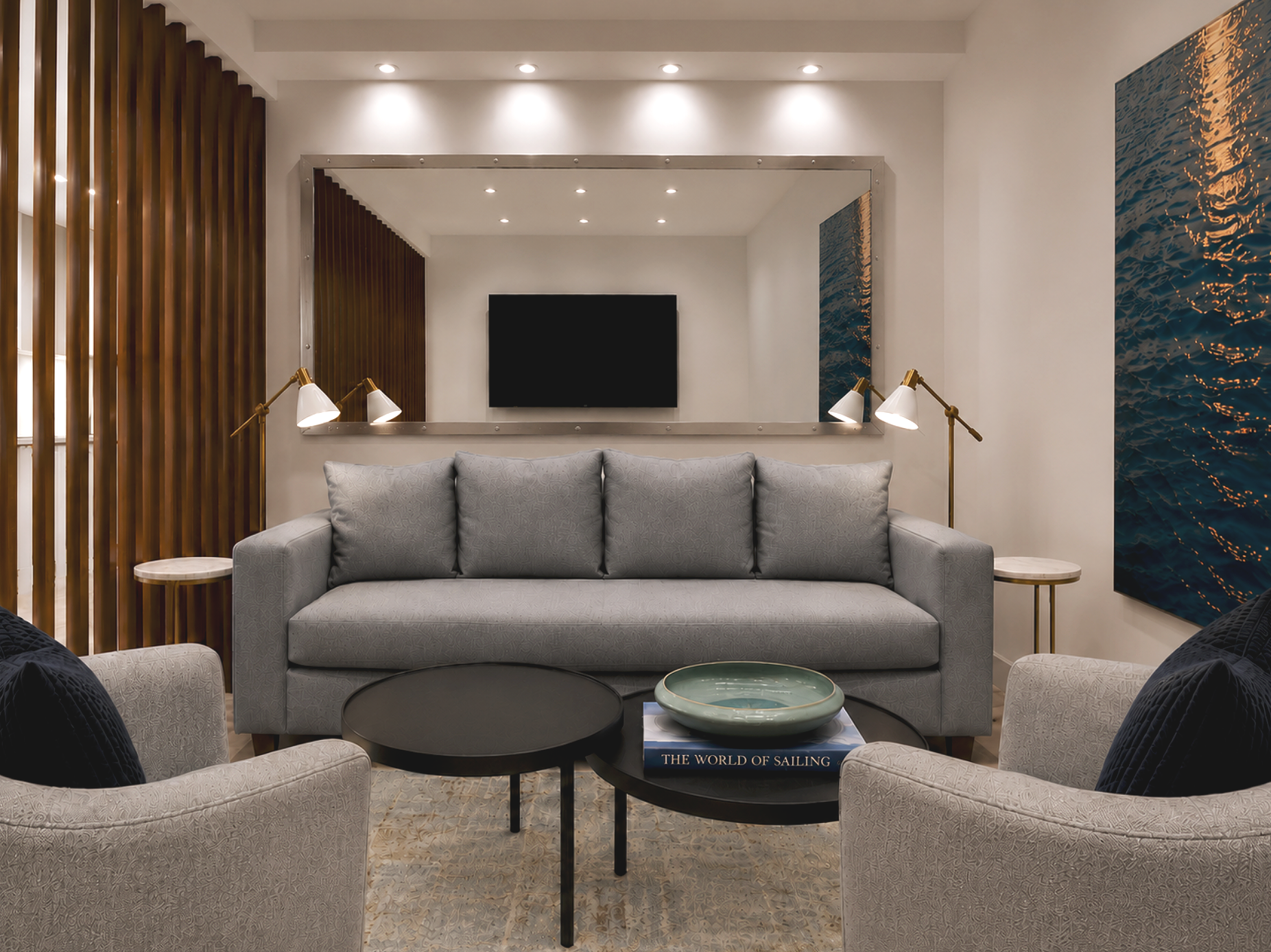 After luxury Hillsboro Beach condominium den remodel featuring a custom white oak slat divider, tailored lounge seating, contemporary lighting, textured wallcovering, and a sophisticated waterfront retreat.