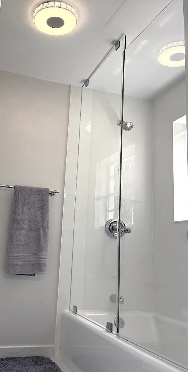 Coconut Grove guest bathroom renovation with glass shower and tub enclosure and clean modern finishes
