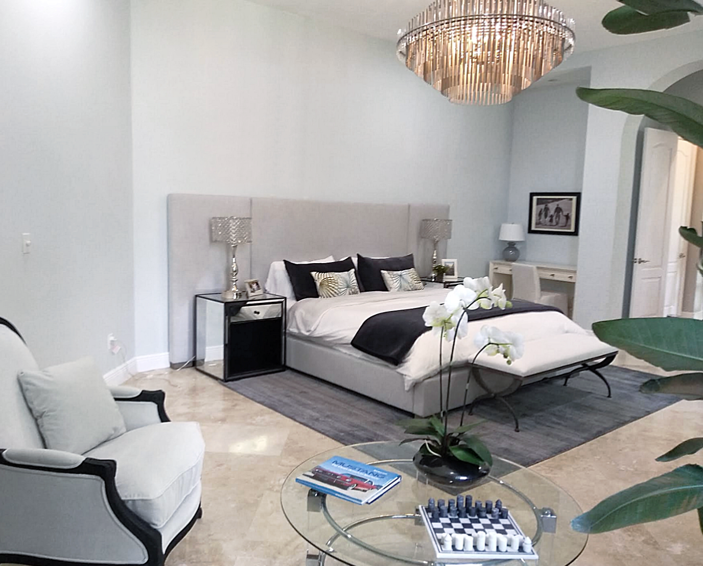 Luxury Coral Gables master bedroom interior design with modern neutral palette and custom furnishings