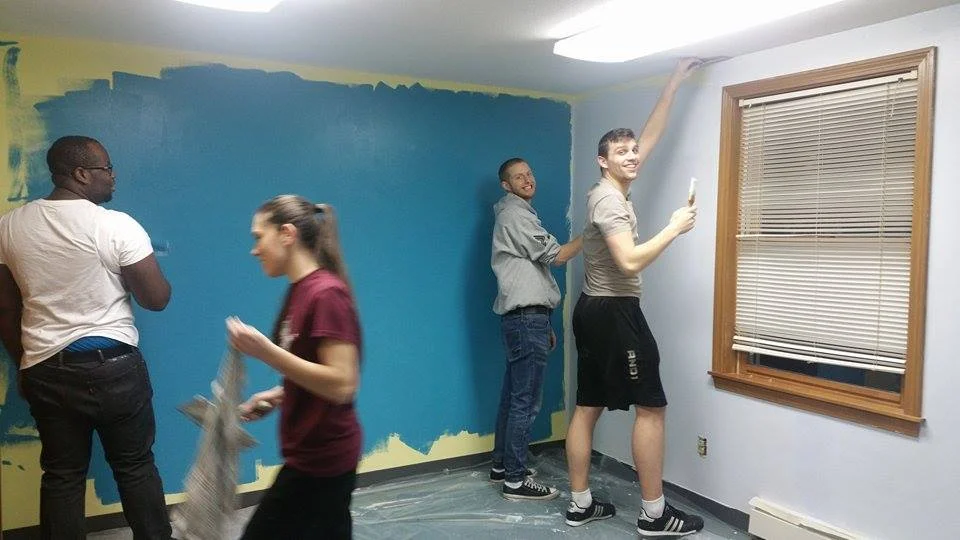 The EAG Youth Leaders painting the room where they have Youth Group on Wednesday Nights.