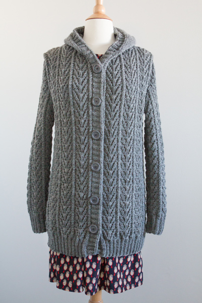 The pattern in the book was a pull-over sweater, so I added button bands to have a front opening, lengthened, and added a hood. 